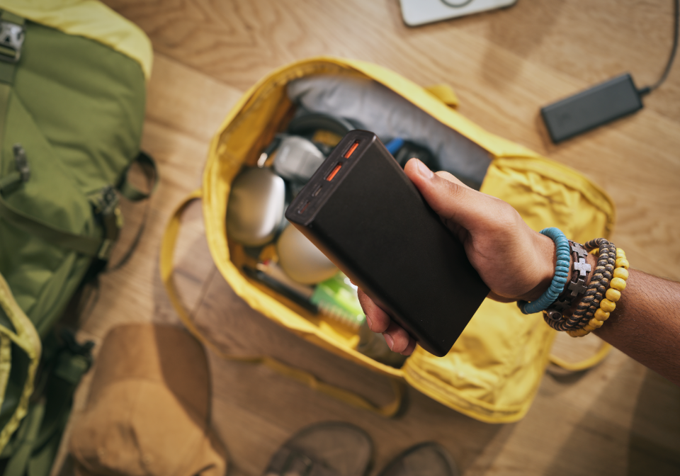 image of a person holding a battery